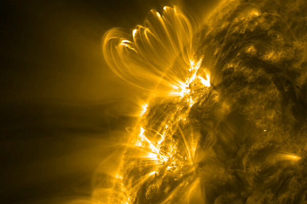 NASA’s Solar Dynamics Observatory captured this image of coronal loops above an active region on the Sun in mid-January 2012.
