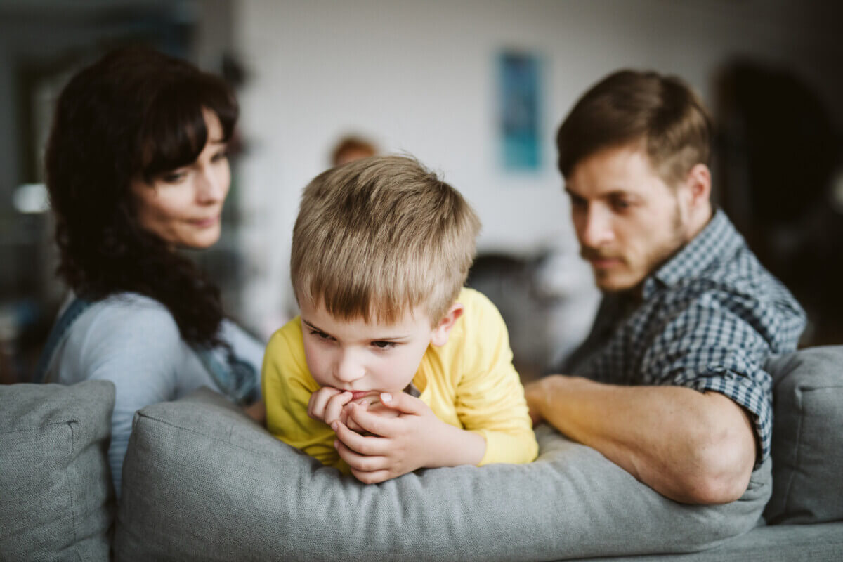 Parents talking to child after bad behavior